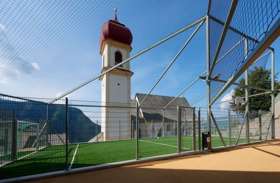 Realizzazione di un campo polivalente con parco giochi spazi di servizio a San Pietro di Laion